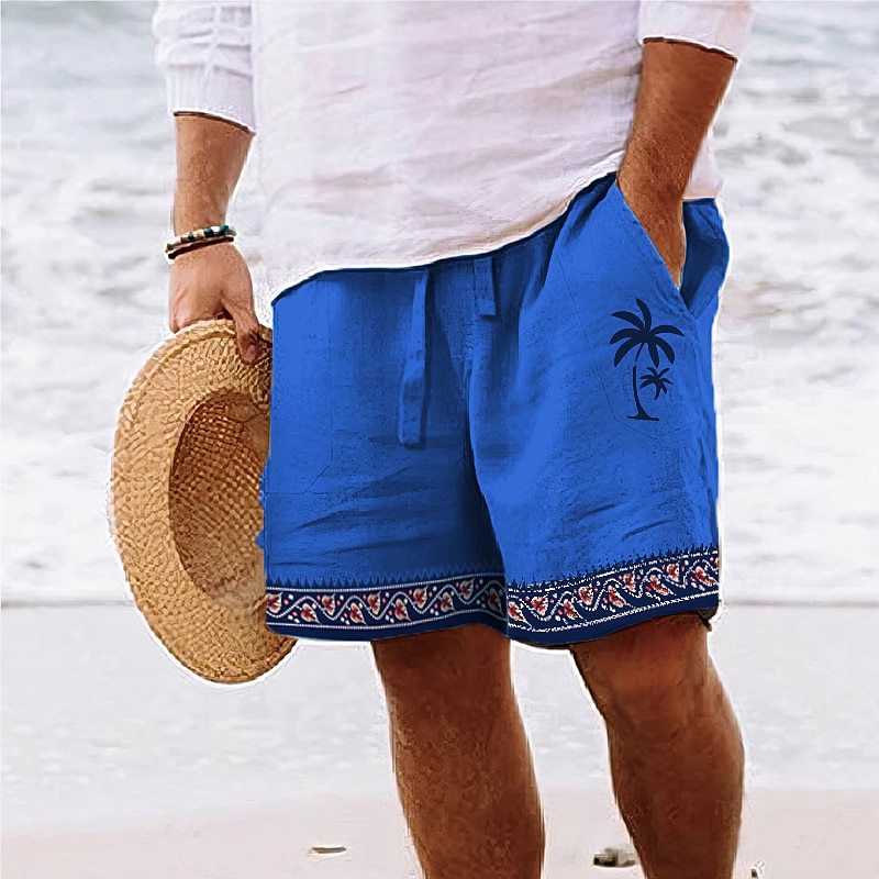 Side view of men's blue tropical print beach shorts with white drawstring.