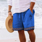Side view of men's blue tropical print beach shorts with white drawstring.